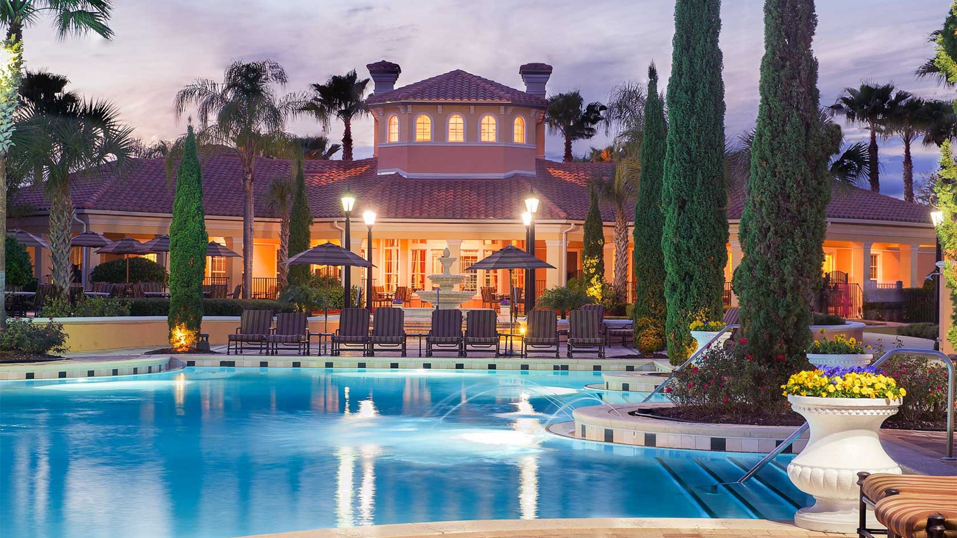 a pool at night with underwater lights on