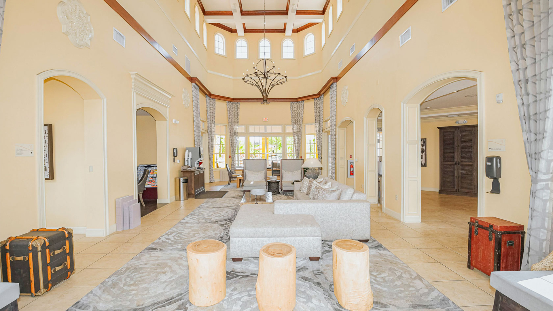 a large living room with a chandelier and a couch